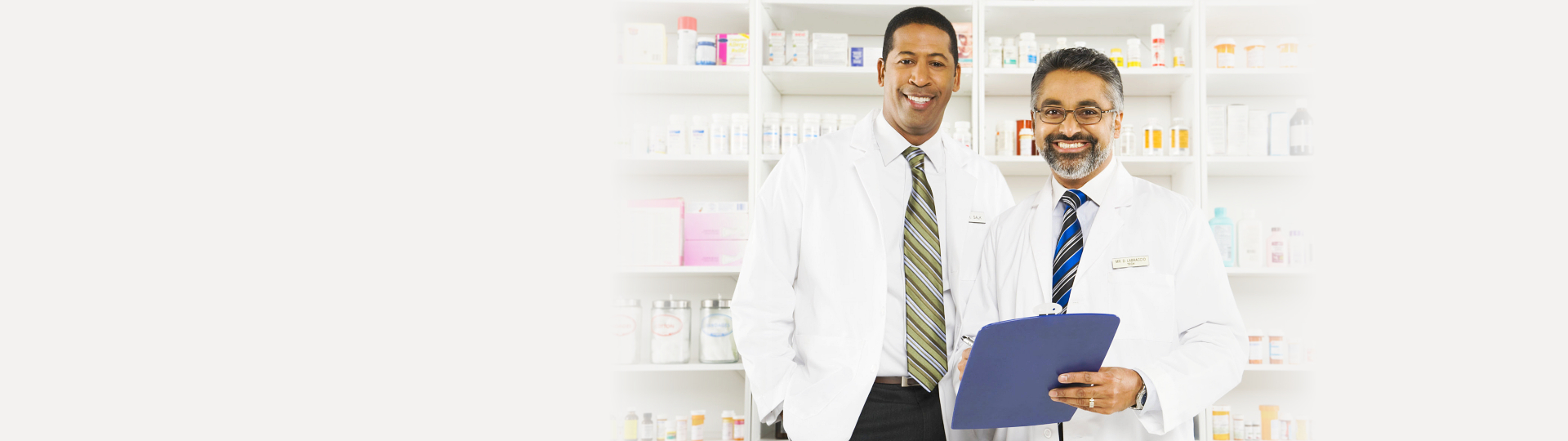 two pharmacists smiling